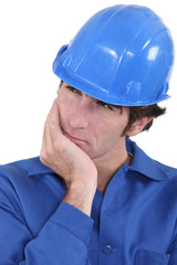 Builder having a good think about what to do next