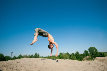 Excited young man jumping in air