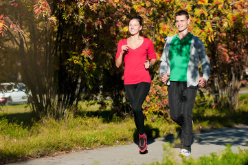 Young man and woman running