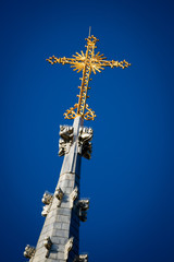 Golden Crucifix Atop Church Steeple