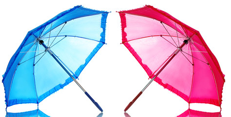 Blue and pink umbrellas isolated on white