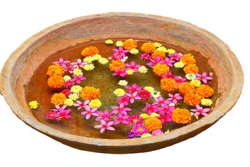 Earthern bowl with flowers - isolated on white