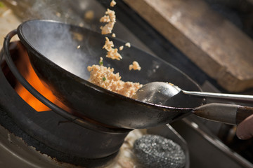Cooking asian stir fry in wok