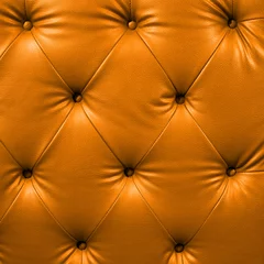 Fotobehang Close-up oranje luxe dichtgeknoopt zwart leer © 2nix