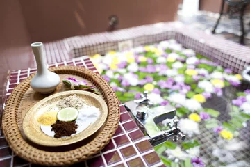 Fotobehang Shallow depth spa massage setting with thai herbal compress stam © 2nix