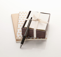 Paper notebooks and a box of cards