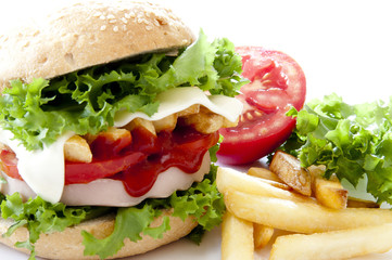 big hamburger, french fries and vegetables
