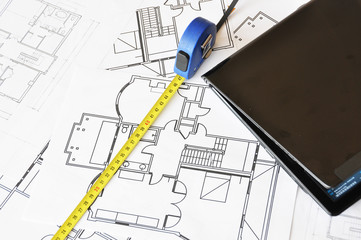 Ruler and notebook on a floor plan