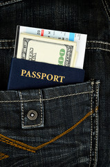 passport with boarding pass and money in jeans