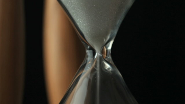 Sand flowing from an egg timer