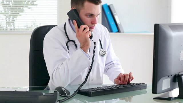 Doctor picking up the phone