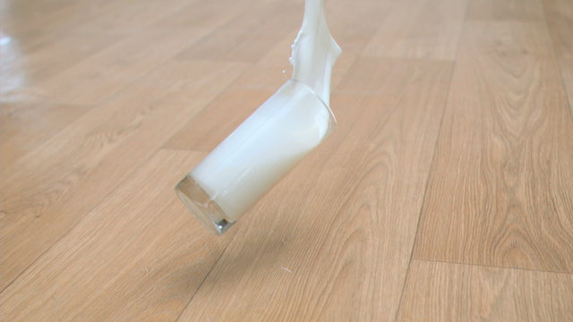 Glass of milk in super slow motion falling