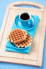 Vertical shot of freshly made waffles and espresso coffee