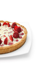 half of the cake with strawberries isolated