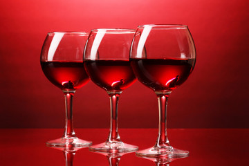 Wineglasses on red background