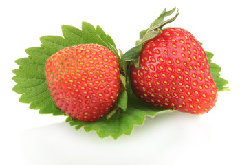 sweet ripe strawberries with leaves isolated on white