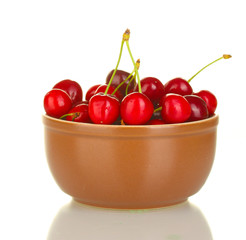 cherry in brown bowl isolated on white