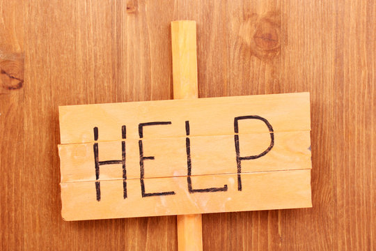 Fototapeta Help wooden board on wooden background