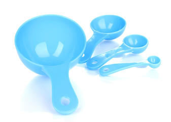 Blue measuring spoons isolated on white