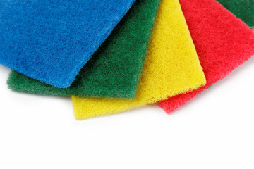 colorful cleaning sponges, isolated on a white background.