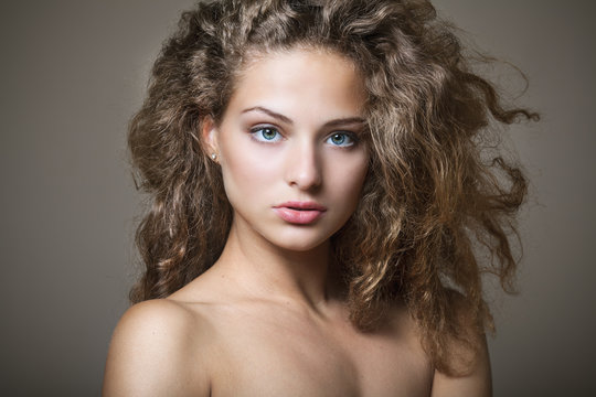 Beautiful young woman with gorgeous curly hair