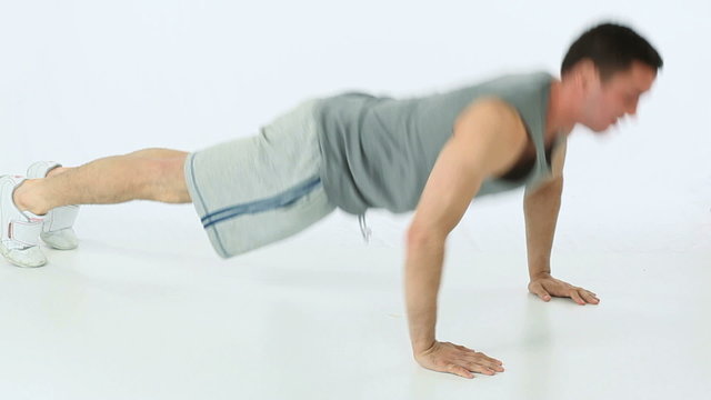Man doing push ups and clapping