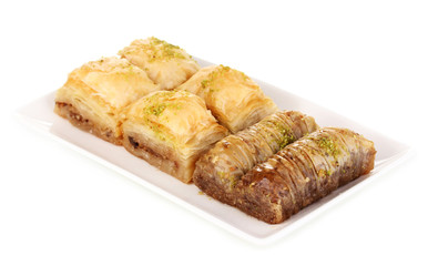 Sweet baklava on plate isolated on white