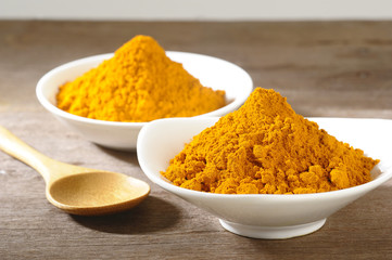 turmeric powder in white dish