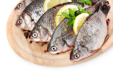 Fresh fishes with lemon, parsley and spice