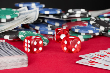 playing cards on a red poker table close-up