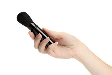 hand with black brush for make-up  isolated on white.