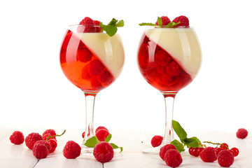 fruit jelly with berries in glasses on wooden table