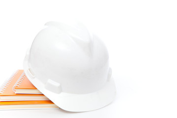 Helmet on book stack in white isolated