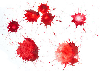 Red blots of watercolor paint