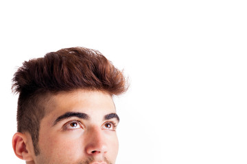 Obraz premium Close-up of handsome young man looking up