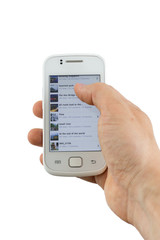 Using and hand holding a white mobile phone