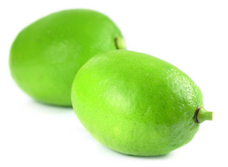Two fresh lemons over white background