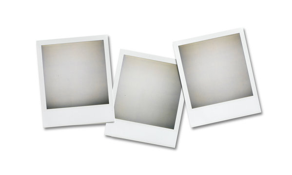 three blank polaroid pictures overhead isolated on white with cl