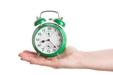 Hand holding alarm clock