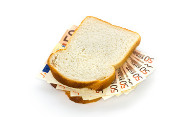Slices of bread with euro banknotes sandwich filling