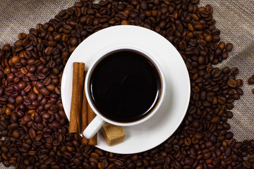 Coffee beans and white cup