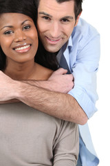 Couple embracing on white background