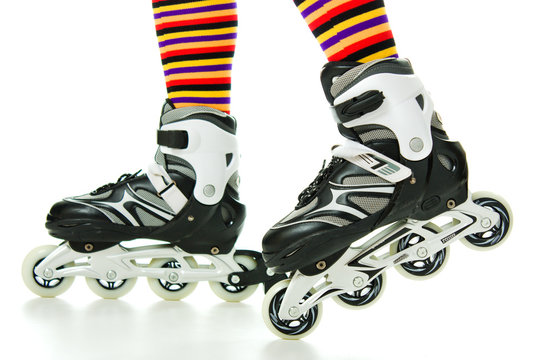 Feminine legs with roller skates