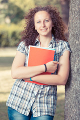 Young Beautiful Female Student at Park