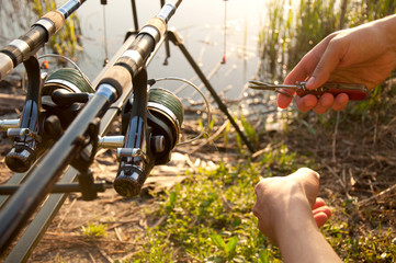 Fisherman hands with equipment