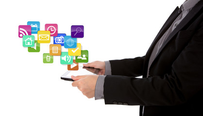 Business man using a touch screen device  with colorful applicat