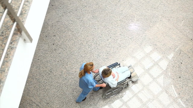 High angle view of a medical team wheeling a patient