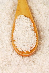 Sea salt with wooden spoon close-up