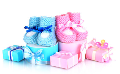 baby boots, pacifier, gifts and blank postcard  isolated