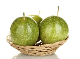 three green passion fruit isolated on white